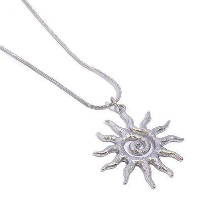 Sonnenamulett und Ohrringe